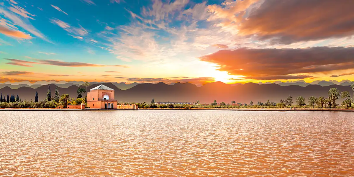 Marrakesh Menara gardens in spring with warm weather and clear skies