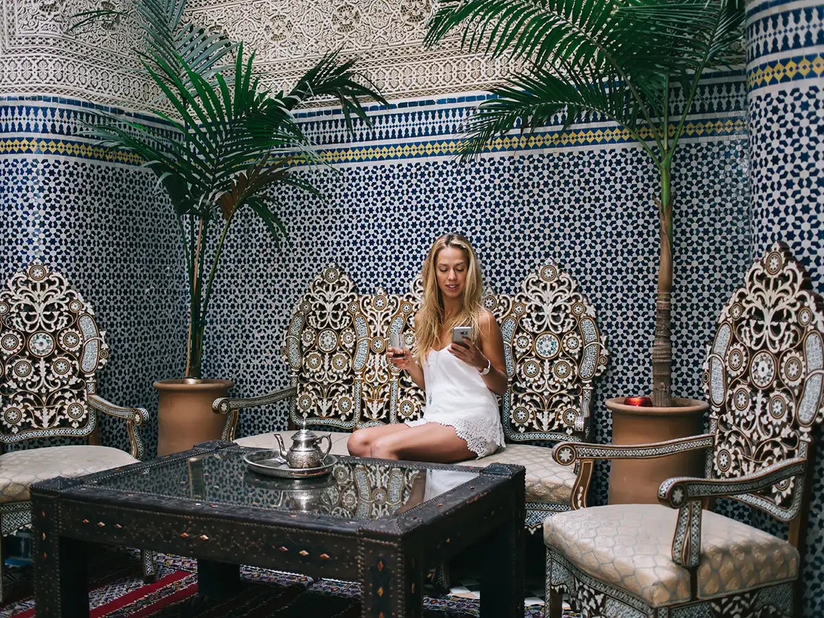 Family arriving at a luxury riad in Morocco with luggage and concierge support